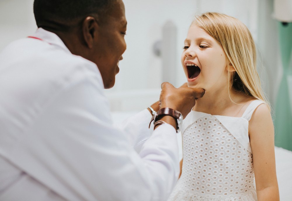 Child smiling during pediatric dental visit at The Port Dental Clinic Calgary NE